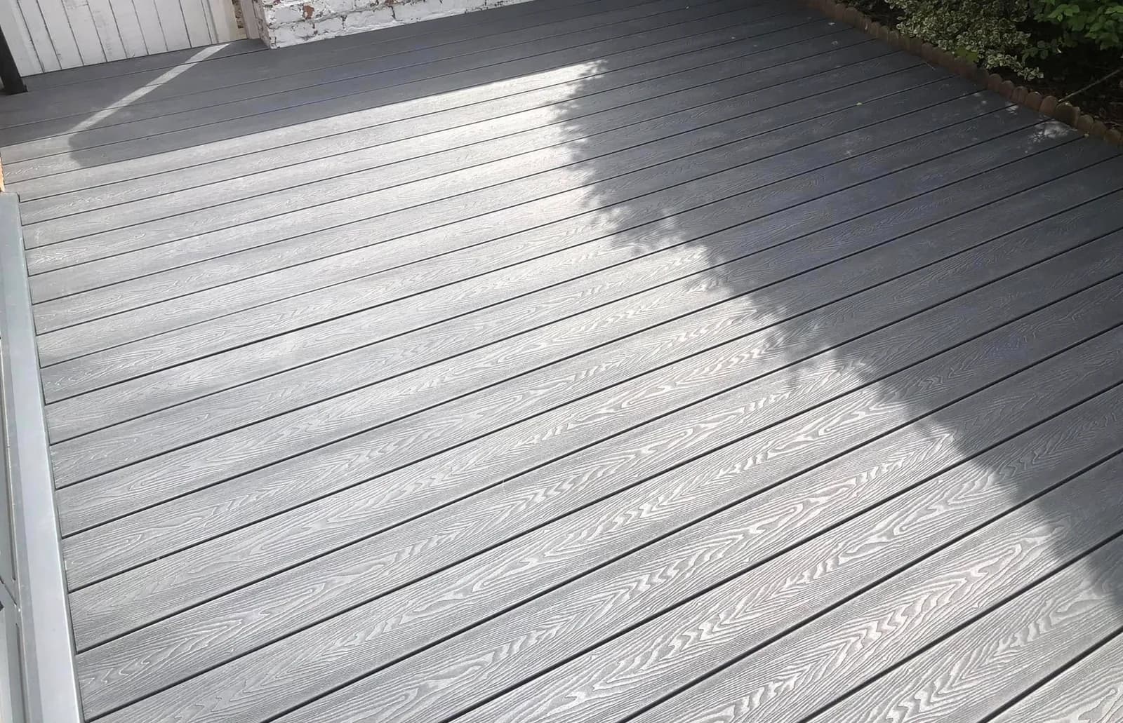 Completed grey composite decking with a clean board and edge finish