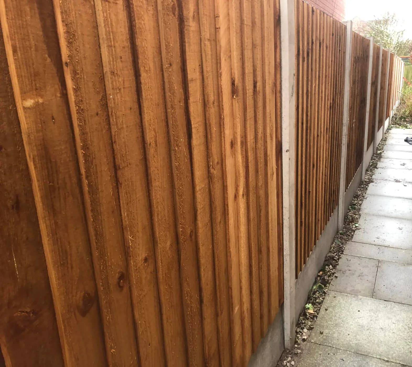 Completed timber garden fencing with concrete posts and gravel boards